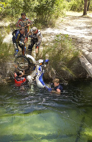 Lifting bike out of creek